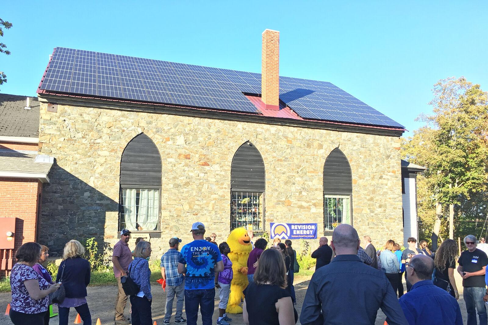 Celebration Of A Solar Array On The Roof Of Stone Church In NH