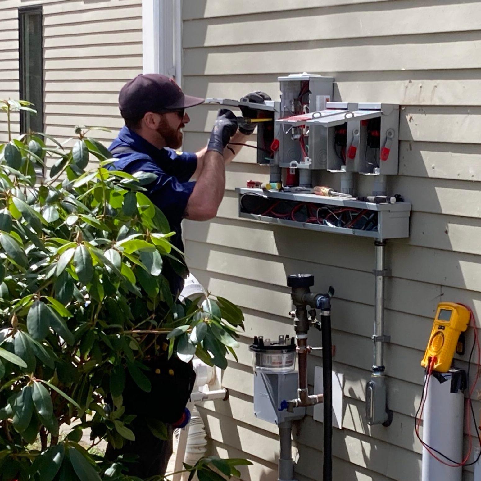 electrician fixing inverter.jpeg