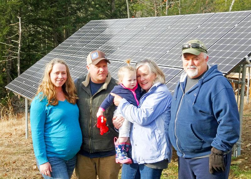 Koutelis Family With Ground Mounted Solar Array