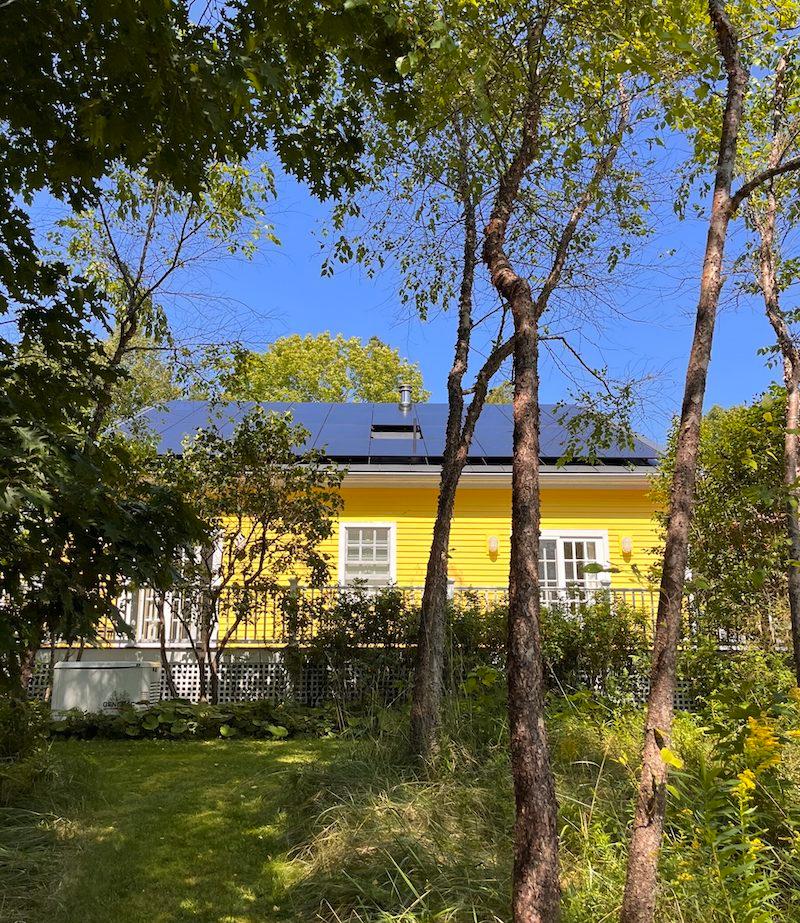 yellow_house_all_black_panels.jpeg