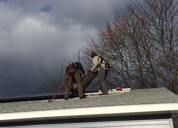 ReVision Energy Workers Installing Solar Panels On A Donated Solar Electric System For A Habitat For Humanity Home In Bangor, Maine
